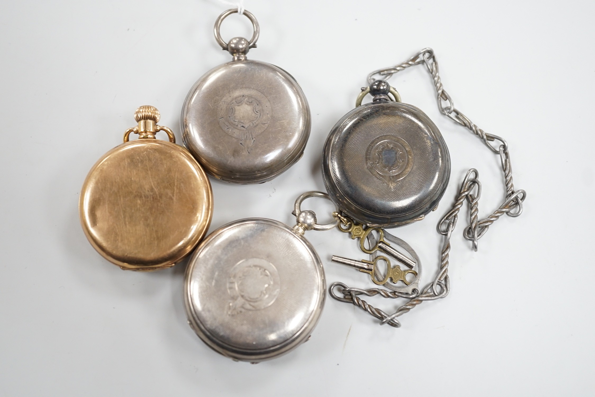 Three white metal open face pocket watches including two silver, one Waltham and a gold plated pocket watch.